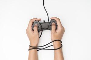 Game Addiction. Wire and gamepad or joystick, wired hands with joypad meaning photo