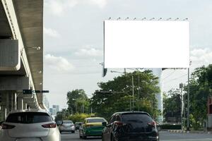 Blank billboard with copy space for text or content, mockup of a blank billboard in a big city, evening scene. Space for your ad.. photo