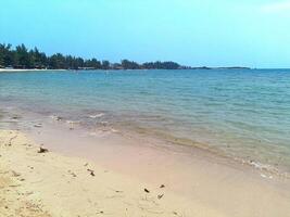 Nature landscape view of beautiful tropical beach and sea in sunny day photo