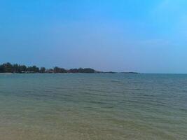 Nature landscape view of beautiful tropical beach and sea in sunny day photo