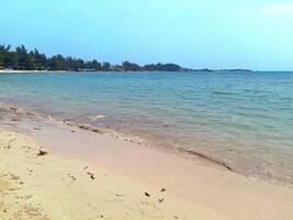 Nature landscape view of beautiful tropical beach and sea in sunny day photo