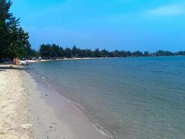 Nature landscape view of beautiful tropical beach and sea in sunny day photo