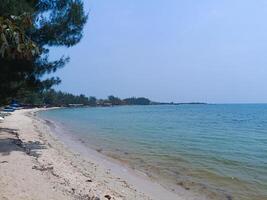 Nature landscape view of beautiful tropical beach and sea in sunny day photo