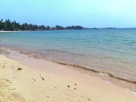Nature landscape view of beautiful tropical beach and sea in sunny day photo