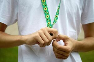 Sunflower lanyard, symbol of people with invisible or hidden disabilities. photo