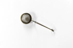 Silver Tea Infuser Flat Lay photo