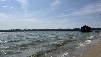 Nature photo of beach with small floating house and small boat. Text copy space for banners, cards.