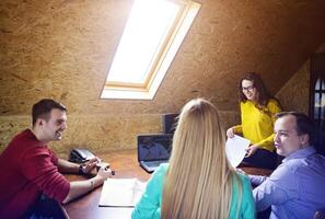 Business team at work with financial reports photo