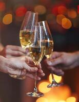 Champagne glasses on red and yellow bokeh background photo