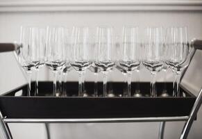Wine glasses on tray at restaurant photo