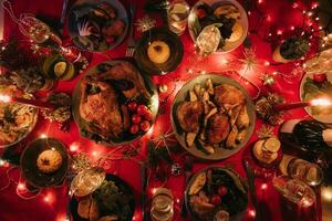 Top view no people shot of decorated Christmas table with variety of food and atmosphere of New Year Eve photo