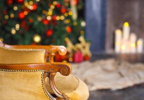 Christmas scene with chair tree gifts and fireplace in background photo