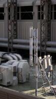 A large group of pipes is seen on the side of a building in a busy cityscape video