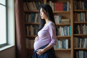 photo of pregnant woman standing with shelf of book on background,