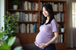 photo of pregnant woman standing with shelf of book on background,