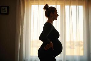 photo of silhouette pregnant woman with white curtain in background,