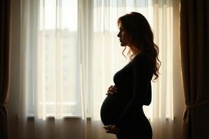 photo of silhouette pregnant woman with white curtain in background,
