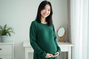 photo of happy pregnant woman standing and posing for picture at her room,