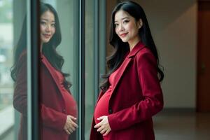 photo of happy pregnant woman standing and posing for picture with mirror and glass wall in background,