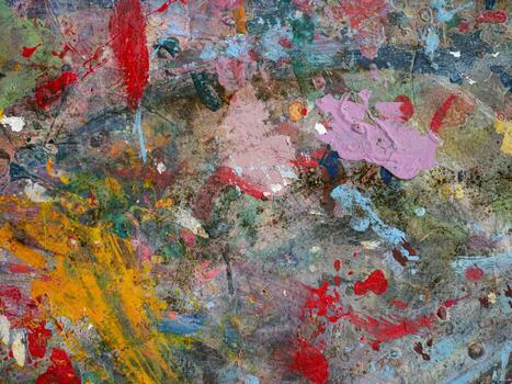 Smeared paint on table with colorful pattern for background photo