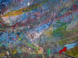 Smeared paint on table with colorful pattern for background photo