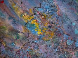 Smeared paint on table with colorful pattern for background photo