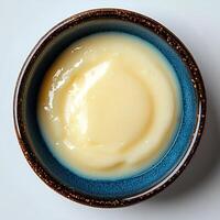 vanilla pudding isolated on white background with shadow. vanilla pudding dessert top view photo