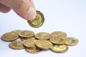 Hand holding golden coins with customizable space for text or ideas. Wealth and copy space concept photo