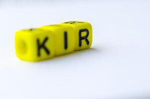 KIR text representing Key Risk Indicator on small square toy on white background. Risk analysis concept photo