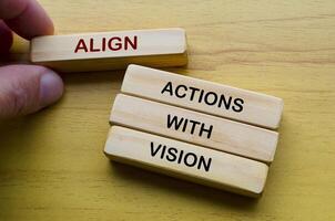 Align actions with vision text on wooden blocks. Operational Excellence concept photo