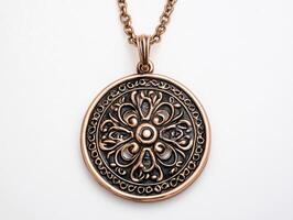 a pendant with an ornate design on it photo