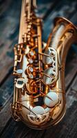 Shiny golden saxophone on wooden surface, intricate details. Jazz music instrument. Vertical banner photo