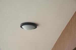 A modern ceiling light fixture enhances the aesthetic of a minimalistic interior design space photo