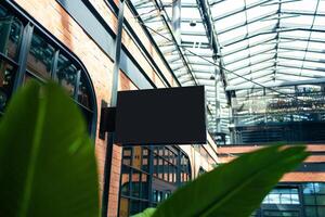 Horizontal side view of empty black signage on business skyscraper with modern architecture photo