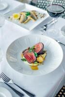 Closeup of a steak with vegetables in a restaurant setting photo
