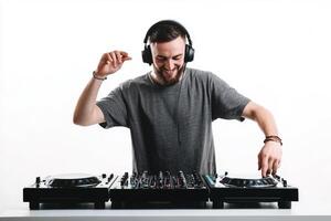 Dynamic male dj creating uplifting beats against a pure white background in a studio setting photo