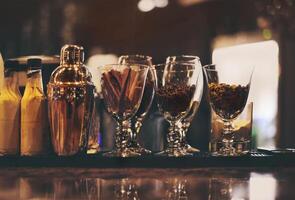 Classic bar counter with bottles in background photo
