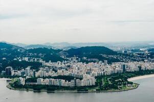 View from bottom of Sugarloaf mountain just dusk overlooking boats on Guanabara bay photo