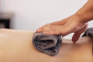 Close-up of neat male masseur hands lying on a towel photo