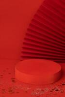 Empty holiday template for design with red round stage. Bright background with sparkles and confetti. photo