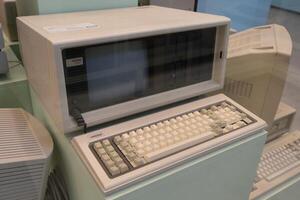 The first old computer COMPAQ. Retro device. Compaq Computer Corporation machine. Poland, Warsaw - July 28, 2023 photo
