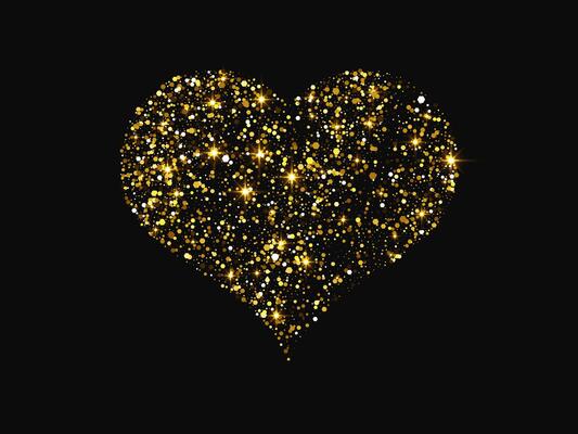 Gold glitter heart on dark background