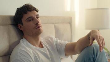 Caucasian European man pensive thoughtful thinking sadness bored bedroom bed home male tired guy failure grief loneliness upset sigh contemplation boredom reflection solitude frustration exhaustion photo