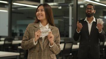 Asian happy smiling rich business girl Chinese woman Korean businesswoman big money financial success Japanese female office sad failure businessman man male guy counting little finance unequal salary photo