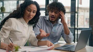 Professional mentor Arabian businesswoman help teach Indian worker analysis explain web project laptop difficult business quarrel conflict misunderstanding teamwork woman man use computer at office photo