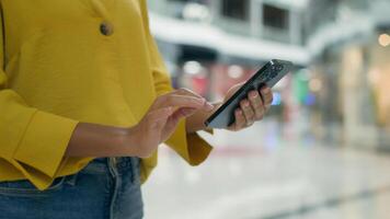 Close up hands unrecognizable woman holding mobile phone smartphone cellphone tech online ordering internet buyer chatting texting shopping mall client web digital gadget cyberspace customer ecommerce photo