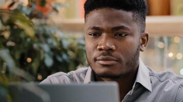 Close-up pensive confident manager freelancer working on laptop writes report thinks about solving problem startup new idea focused deep in thought young journalist writer thinking about writing novel photo