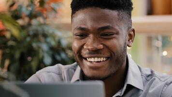 Close-up serious pensive male student freelancer thinks over project young puzzled businessman searching solution problem deep in thought remembers finds idea smiling enthusiastic typing on laptop photo