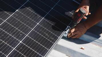 Connection and installation of solar panels. Workers attach solar panels. Technicians install solar panels on a metal stand. Workers install photovoltaic solar panels on the roof of a house photo