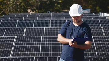 A chief engineer oversees the installation of solar panels on a rooftop. The scene highlights expert supervision and modern renewable energy solutions in action photo